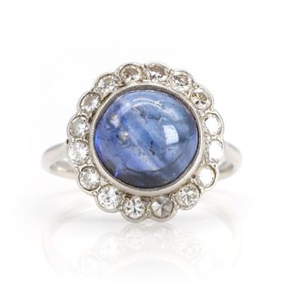 Lot 102 - A sapphire and diamond cluster ring