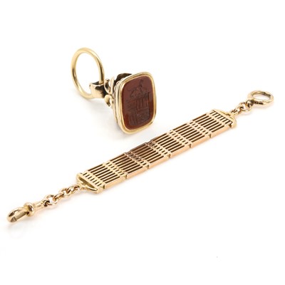 Lot 328 - A Victorian carnelian seal fob suspended by a gate link watch chain