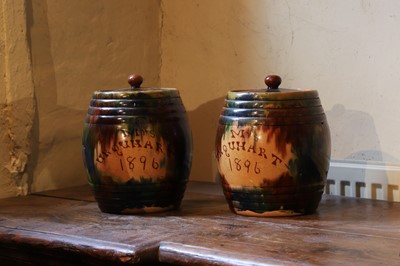 Lot 517 - A pair of large glazed earthenware storage jars and covers