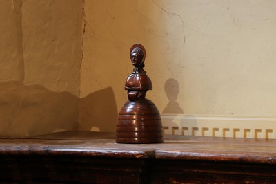 Lot 536 - A treen caricature walnut money bank