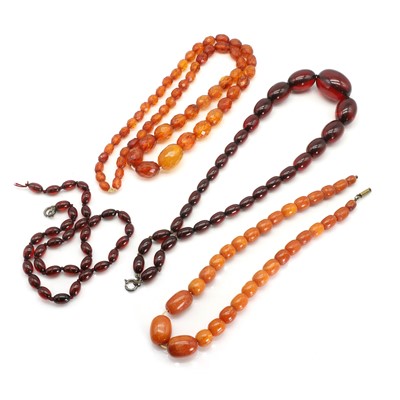 Lot 281 - A small group of Bakelite and amber bead necklaces