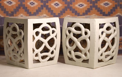 Lot 612 - A pair of cream glazed garden seats