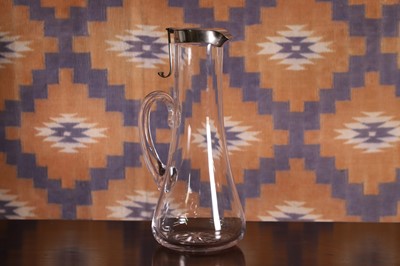 Lot 519 - A silver mounted glass claret jug