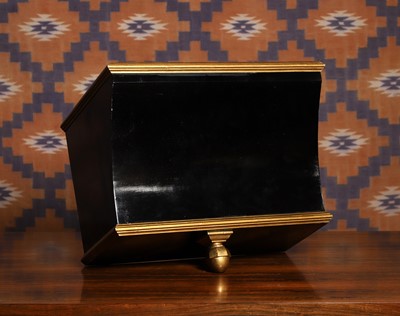 Lot 536 - An ebonised and parcel gilt wall bracket