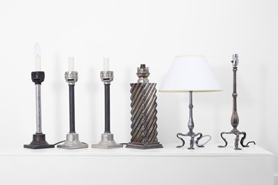 Lot 41 - A collection of silvered-metal oil and table lamps