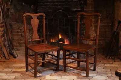 Lot 524 - A pair of George II provincial ash and elm side chairs