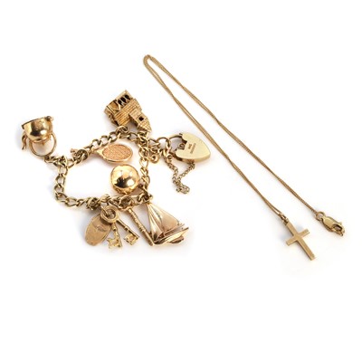 Lot 267 - A 9ct gold charm bracelet and a cross pendant