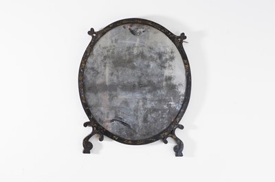 Lot 73 - A Regency black and gilt-japanned oval mirror
