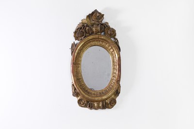 Lot 27 - A small baroque carved giltwood mirror