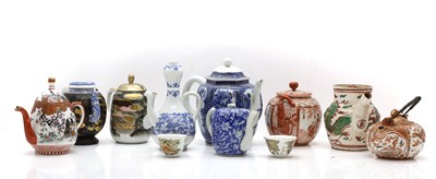Lot 91 - A collection of Japanese teapots and covers
