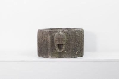 Lot 253 - A medieval carved limestone pot quern