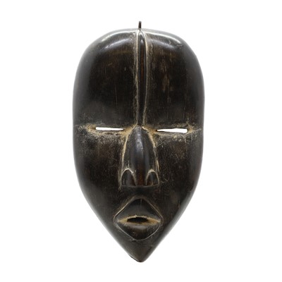 Lot 468 - A carved hardwood Dan mask