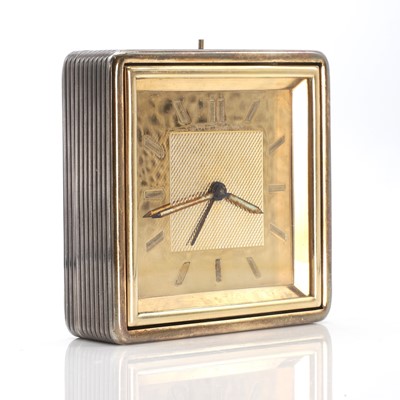 Lot 342 - A sterling silver and gold travel alarm clock, by Boucheron