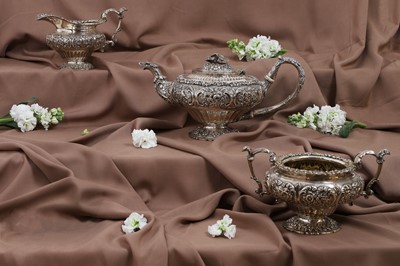 Lot 624 - A George IV three-piece silver-gilt tea service