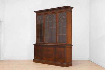 Lot 445 - A George III-style walnut library bookcase