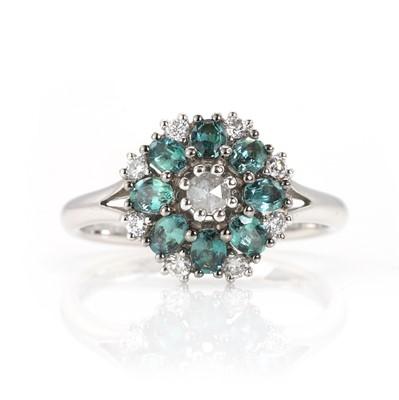 Lot 233 - A white gold chrysoberyl Alexandrite and diamond cluster ring