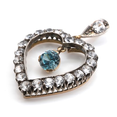 Lot 100 - A blue zircon and colourless spinel heart shaped pendant
