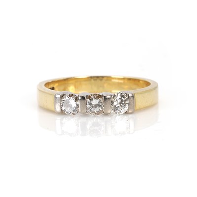 Lot 58 - An 18ct gold three stone diamond ring