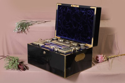 Lot 328 - A Victorian ebonised and brass-bound travelling dressing case