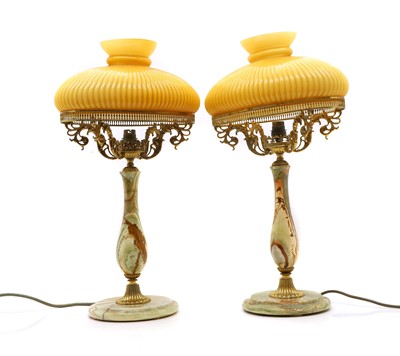 Lot 538 - A pair of gilt metal and onyx table lamps