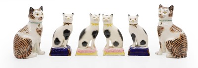 Lot 317 - Three pairs of Staffordshire type pottery cats