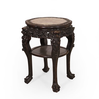 Lot 570 - A Chinese hardwood marble-topped urn stand