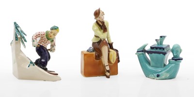 Lot 330A - A Goebel ceramic figure of a lady seated on a suitcase