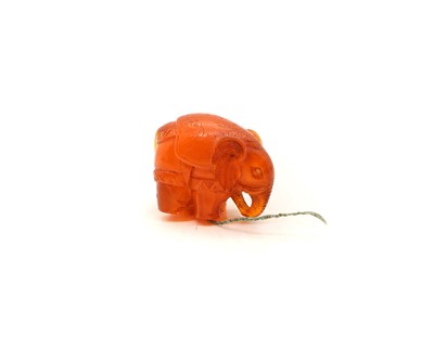 Lot 374 - An amber carving