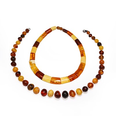 Lot 313 - Two amber bead necklaces