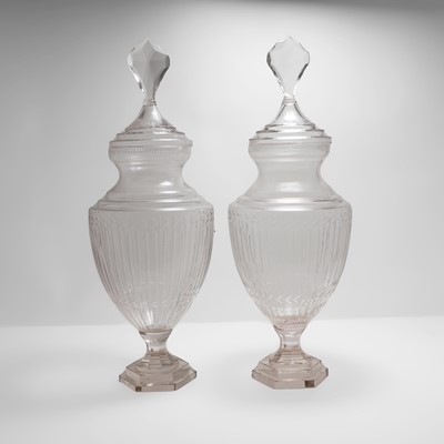 Lot 330 - A pair of clear glass vases and covers