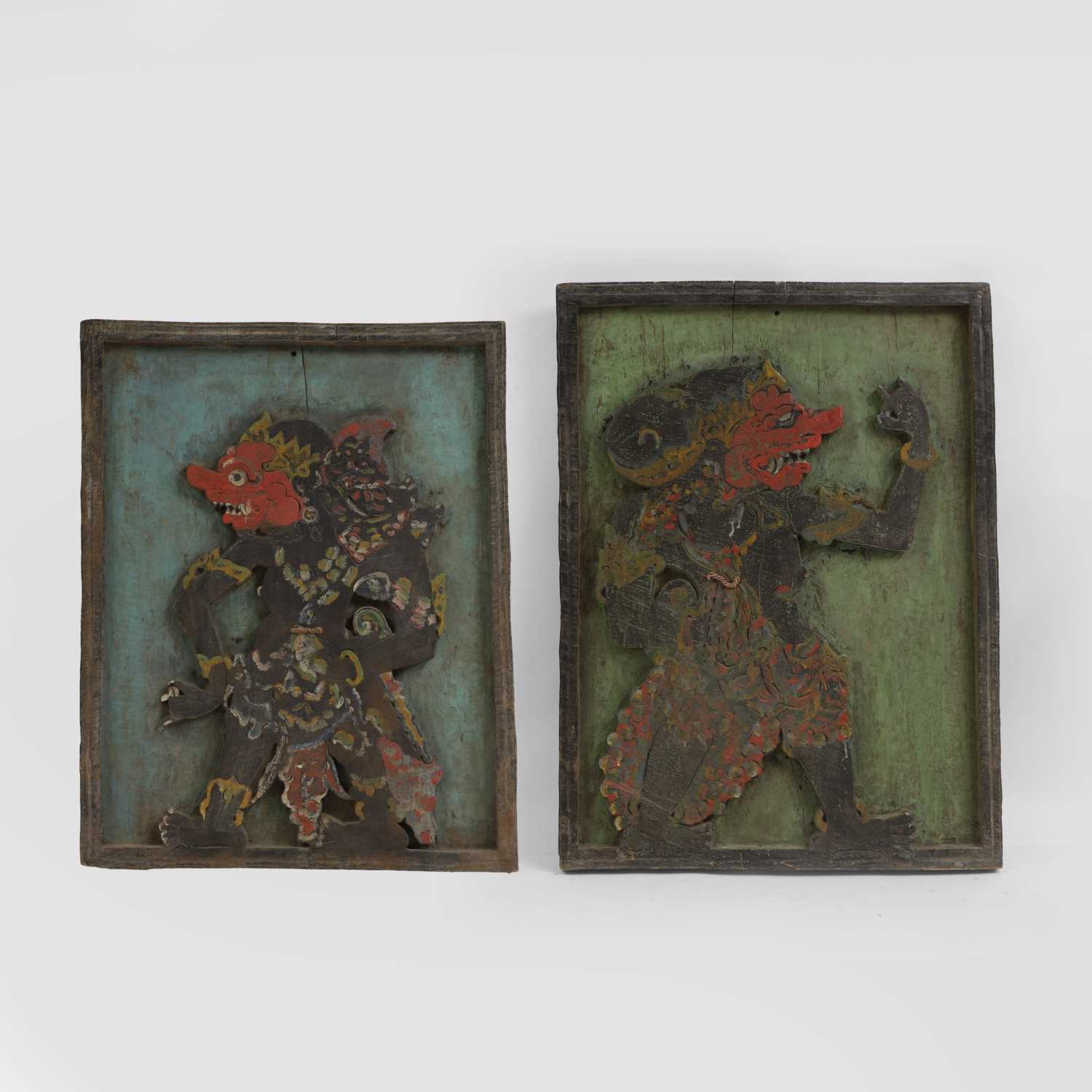 Lot 216 - A pair of carved wooden panels