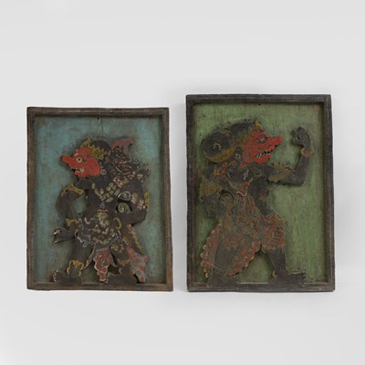 Lot 216 - A pair of carved wooden panels