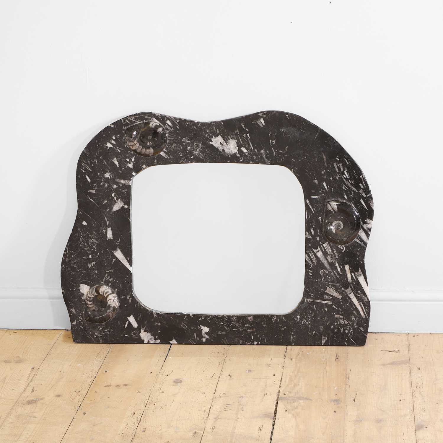 Lot 150 - A fossil marble mirror