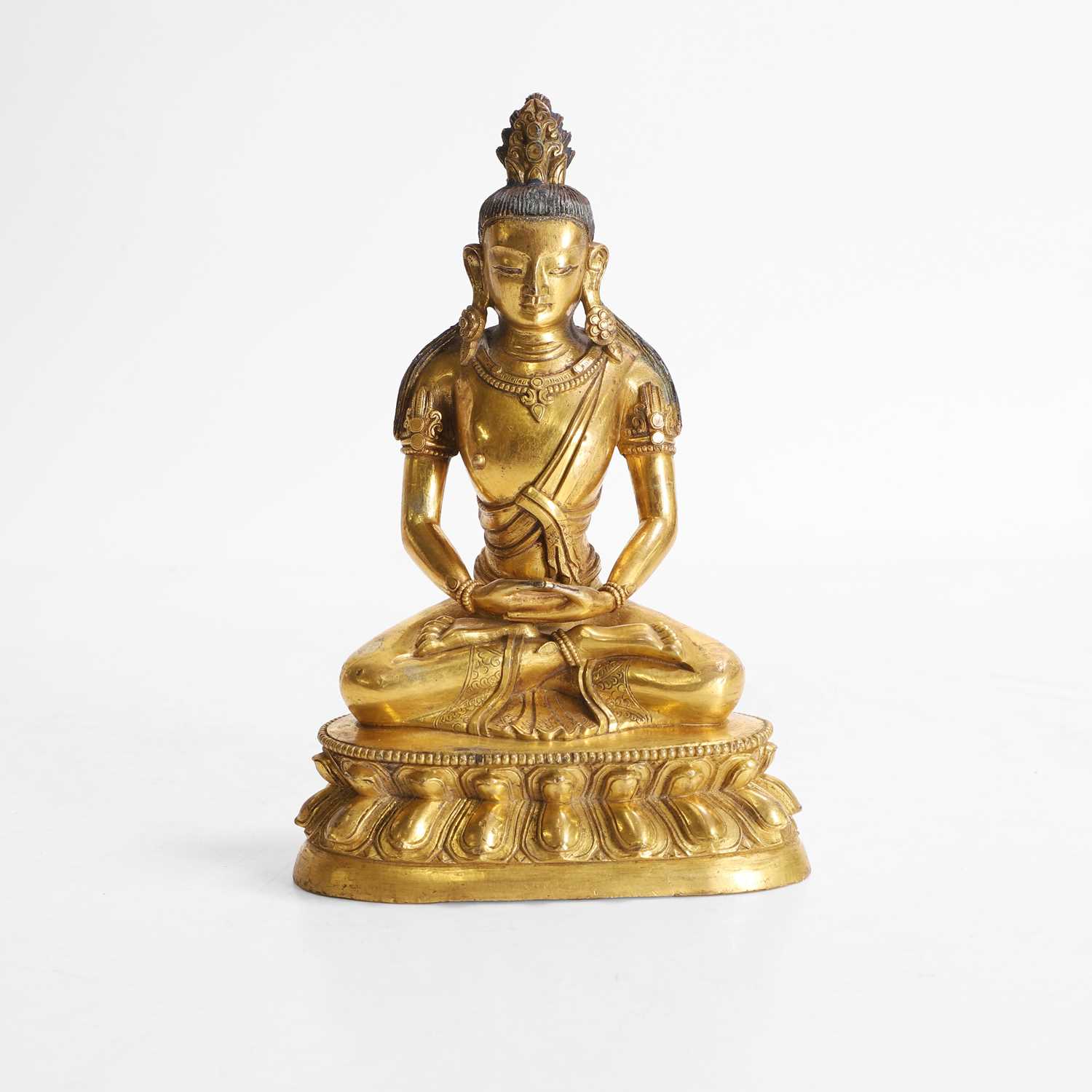Lot 340 - A Chinese gilt-bronze Buddha