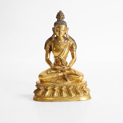 Lot 340 - A Chinese gilt-bronze Buddha