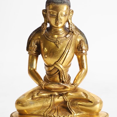 Lot 340 - A Chinese gilt-bronze Buddha
