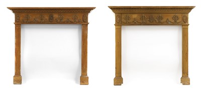 Lot 582 - A pair of George III-style carved pine chimneypieces
