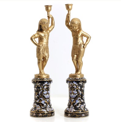 Lot 309 - A pair of gilt metal candlesticks
