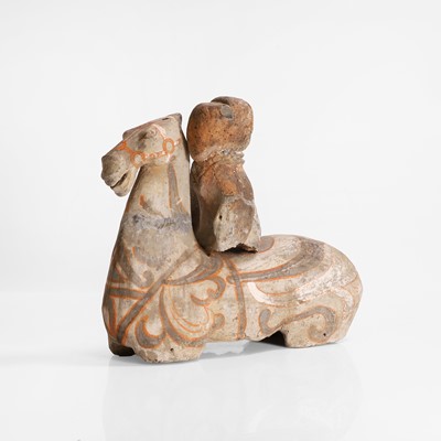 Lot 319 - A pottery figure of a horse and rider