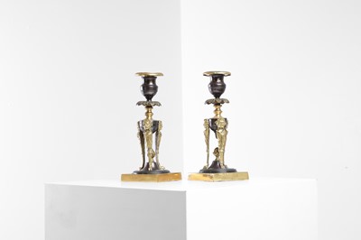 Lot 408 - A pair of Regency bronze and gilt-metal candlesticks