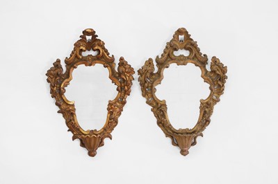 Lot 494 - A pair of carved and painted wooden wall mirrors