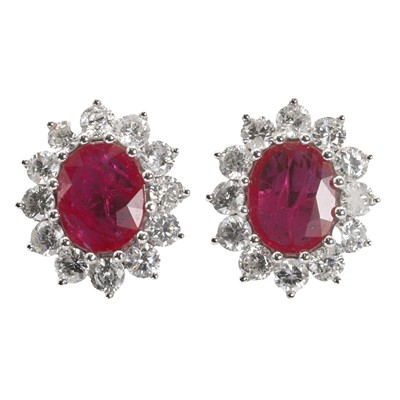 Lot 181 - A pair of white gold ruby and diamond cluster stud earrings
