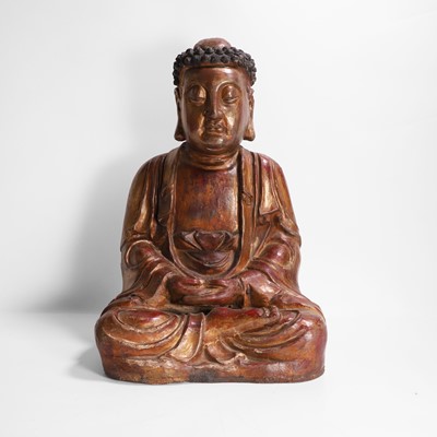 Lot 215 - A gilt-lacquer wood and composition figure of seated Buddha