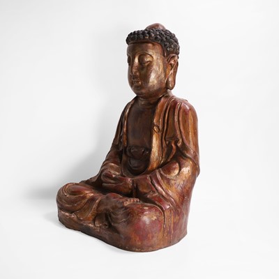 Lot 215 - A gilt-lacquer wood and composition figure of seated Buddha