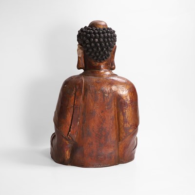 Lot 215 - A gilt-lacquer wood and composition figure of seated Buddha