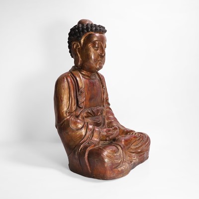 Lot 215 - A gilt-lacquer wood and composition figure of seated Buddha