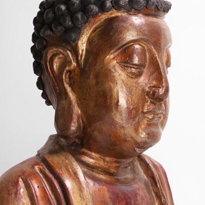 Lot 215 - A gilt-lacquer wood and composition figure of seated Buddha