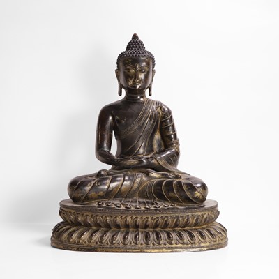 Lot 222 - A gilt-bronze figure of seated Buddha