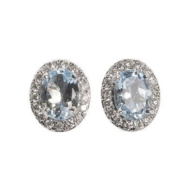 Lot 268 - A pair of white gold aquamarine and diamond cluster earrings