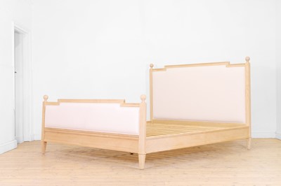 Lot 235 - A carved wooden double bed in the French taste